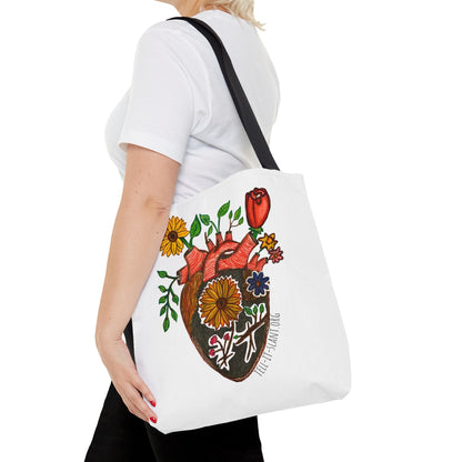 Bolsa de tela literaria única con corazón anatómico y flores en crecimiento